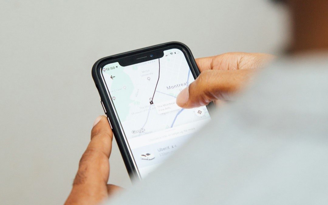 Man holding a smartphone in both hands to set up a mobile payment app