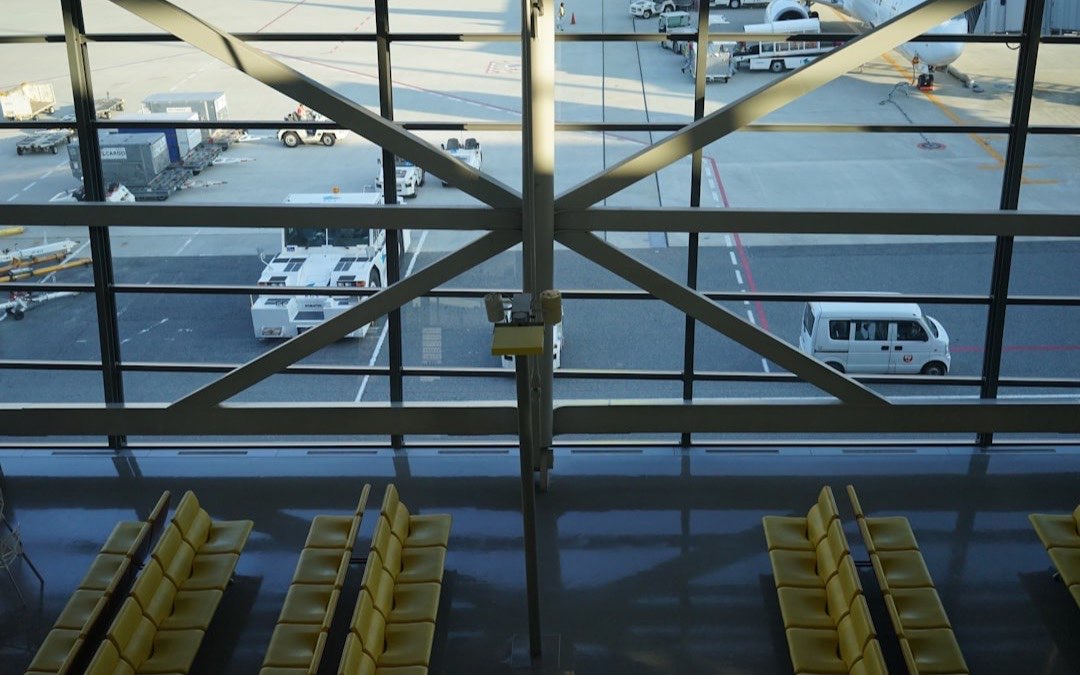Aircraft on the apron viewed through an airport terminal window